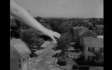 Alien girl's hand in toy city